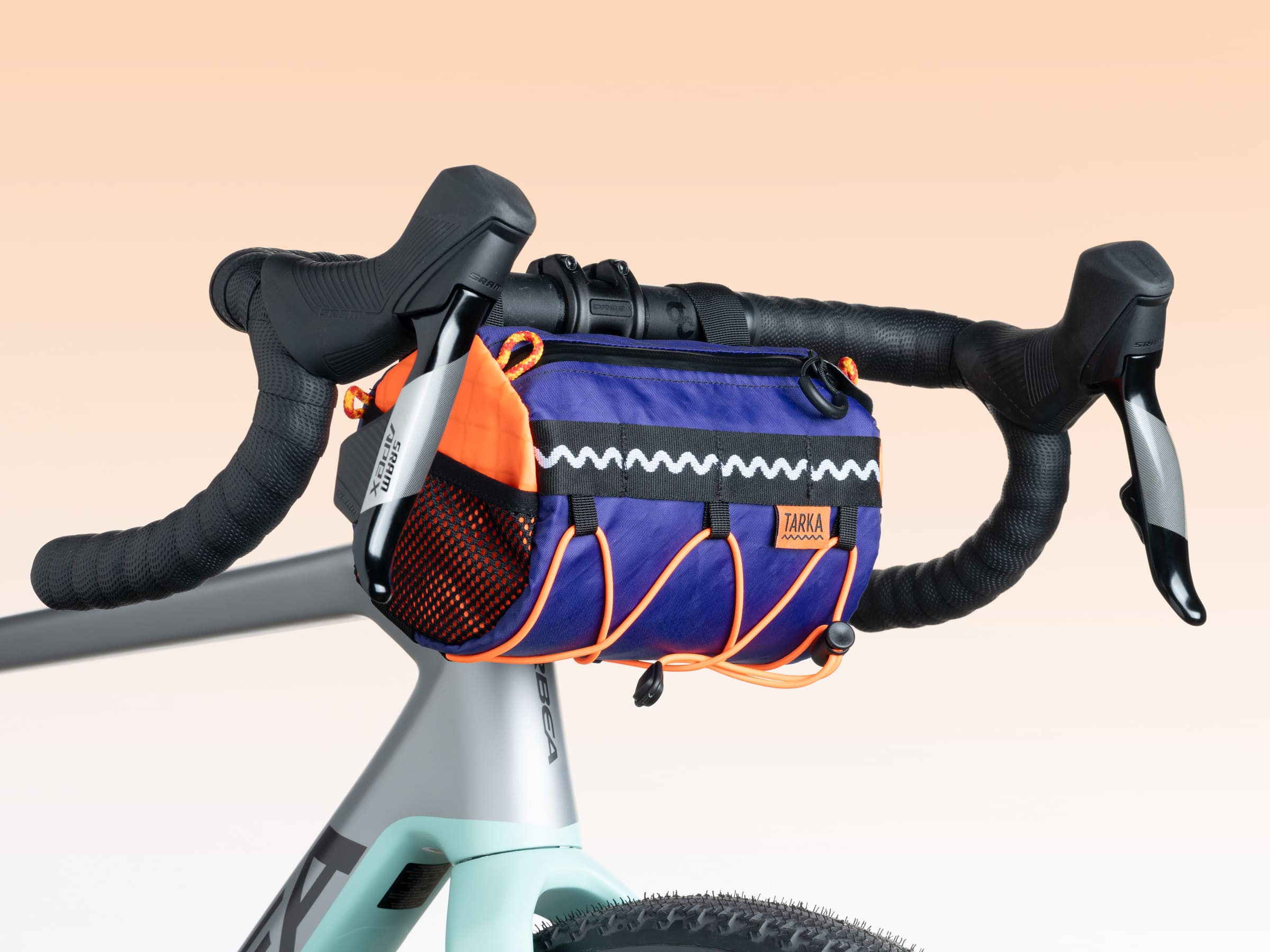handlebar bag for gravel bike Handlebar Burrito Bag Deep Purple/Bright Orange – Tarka